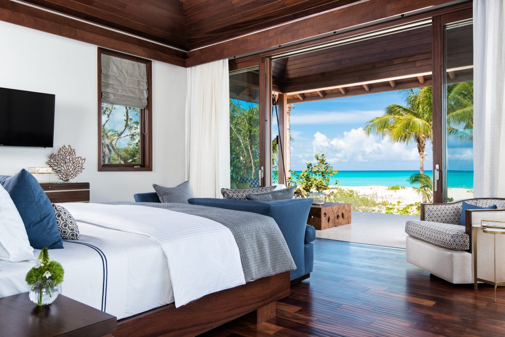 Bedroom with ocean view at Hawksbill Tennis Estate