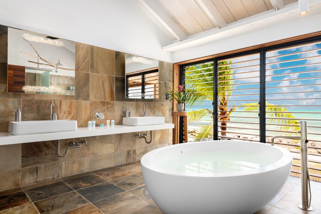 Bathroom with a freestanding bath at Silver Sands Padel Villa
