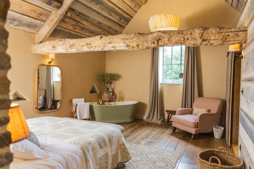 Lilie Farm bedroom with armchair and garden view