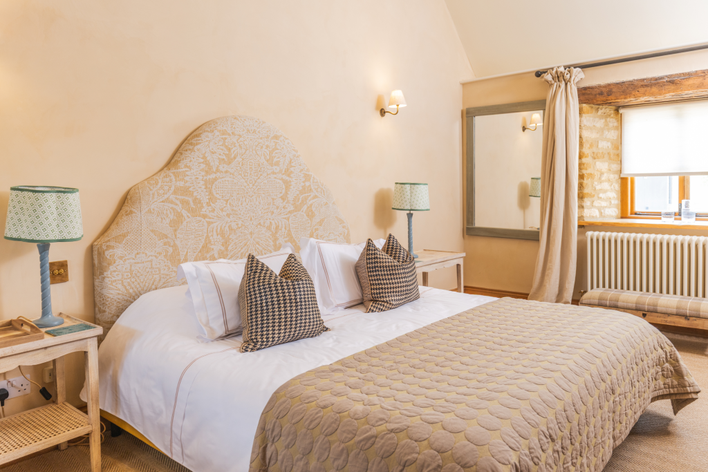 Lilie Farm bedroom with upholstered headboard