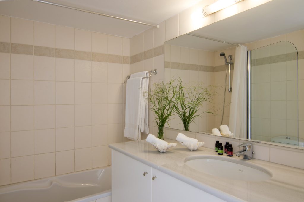 Bright bathroom with double vanity at Villa Eos