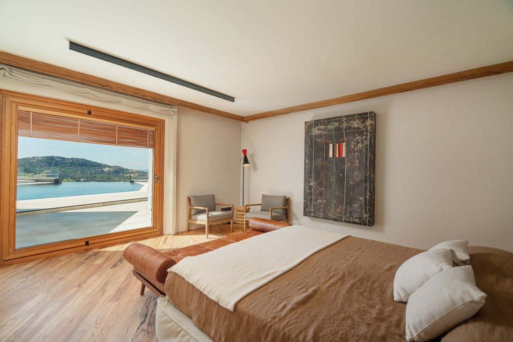 Bedroom with sea view at Villa Roccia Blu