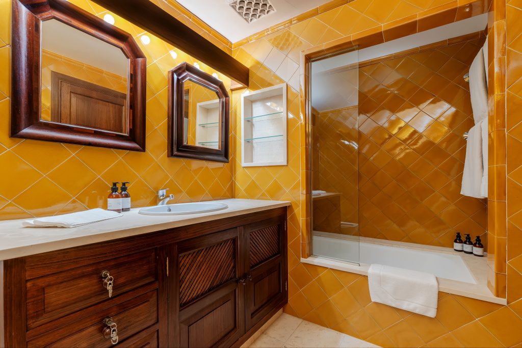 Bathroom with a stone vanity and walk-in shower at Villa Solana