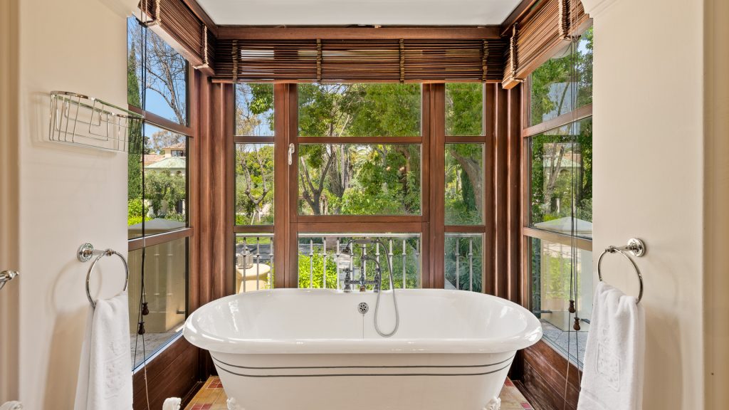Freestanding bathtub in a window bay overlooking the trees at Monte Mar Estate
