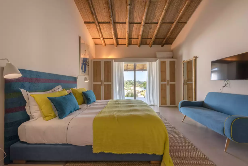 Bedroom with a yellow accent at The Alba Estate