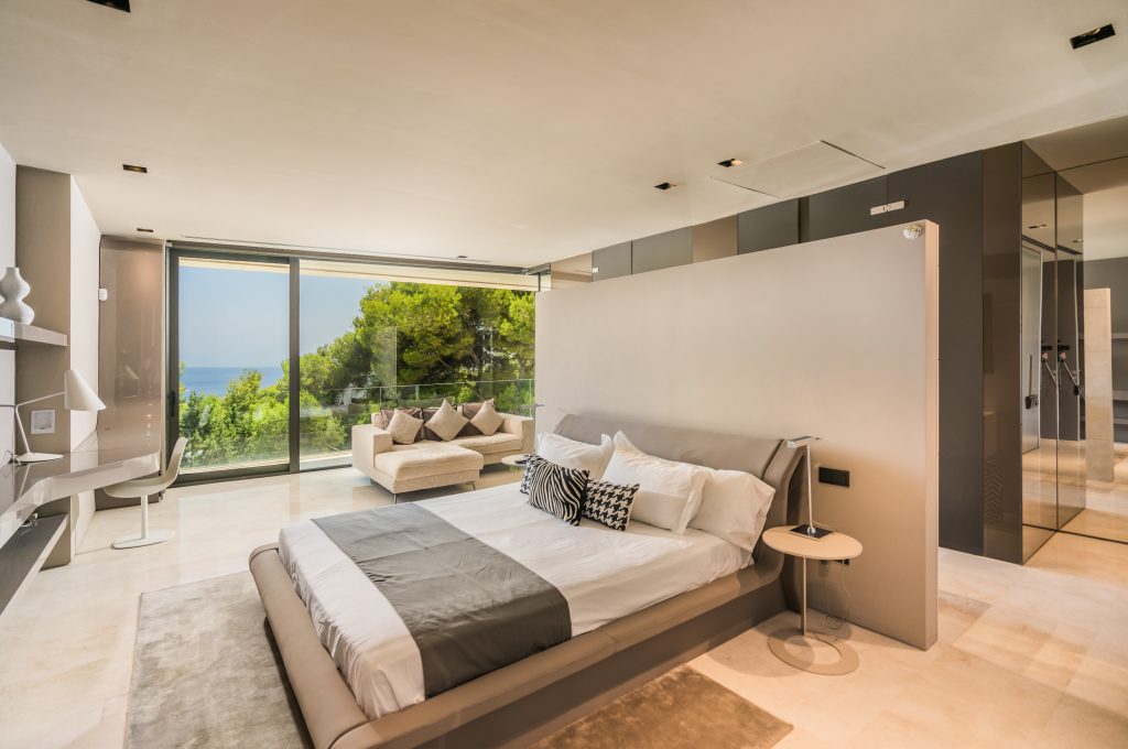 Suite with a bed facing the sea view at Villa Era