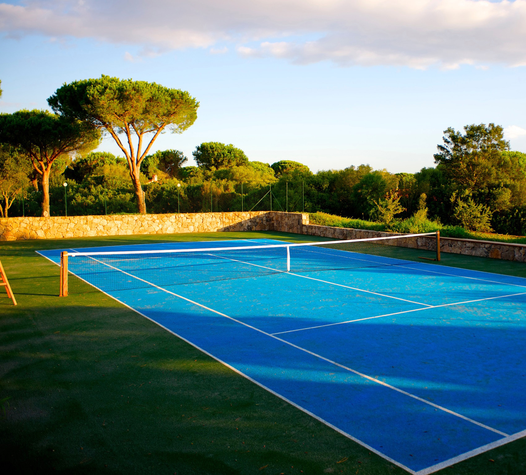 Private tennis court at Villa H2O, a home with a private court for rent in San Teodoro, Sardinia