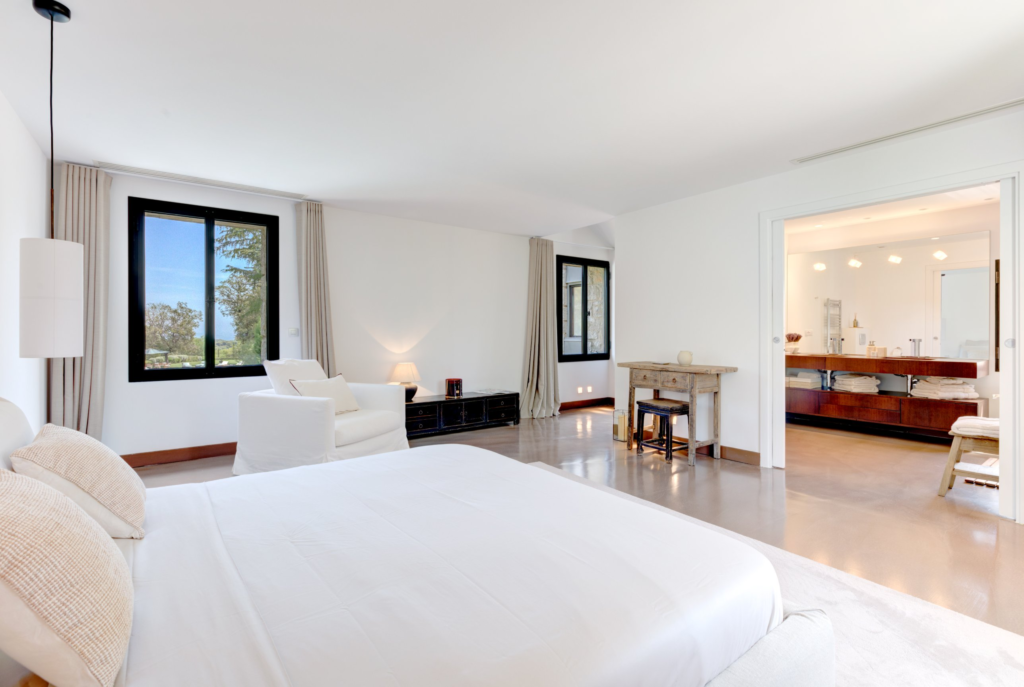 Le Castel master bedroom with garden view and en suite bathroom